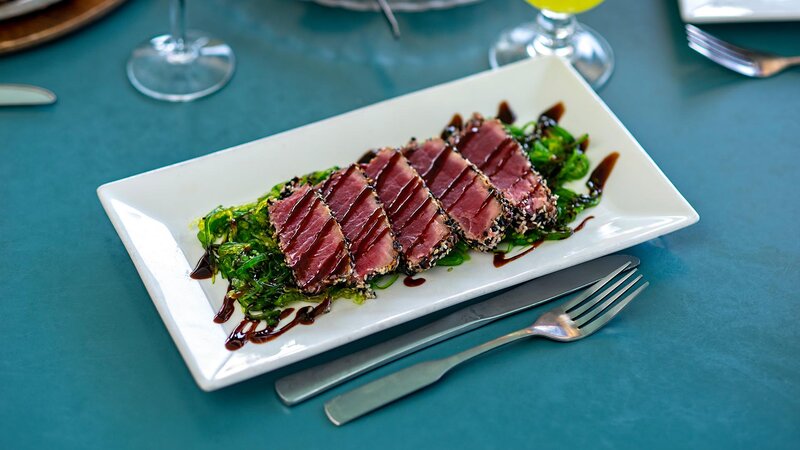 Steak entree on a bed of spinach